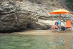 Kathe suntanning on private beach on Pareti Bay