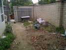 Before: dog area was overgrown & trashy